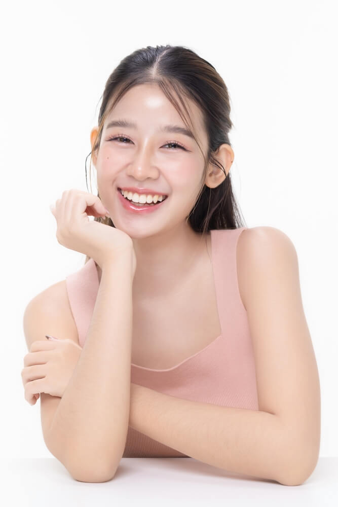 The female patient of Dental Logic is showing her straight smile